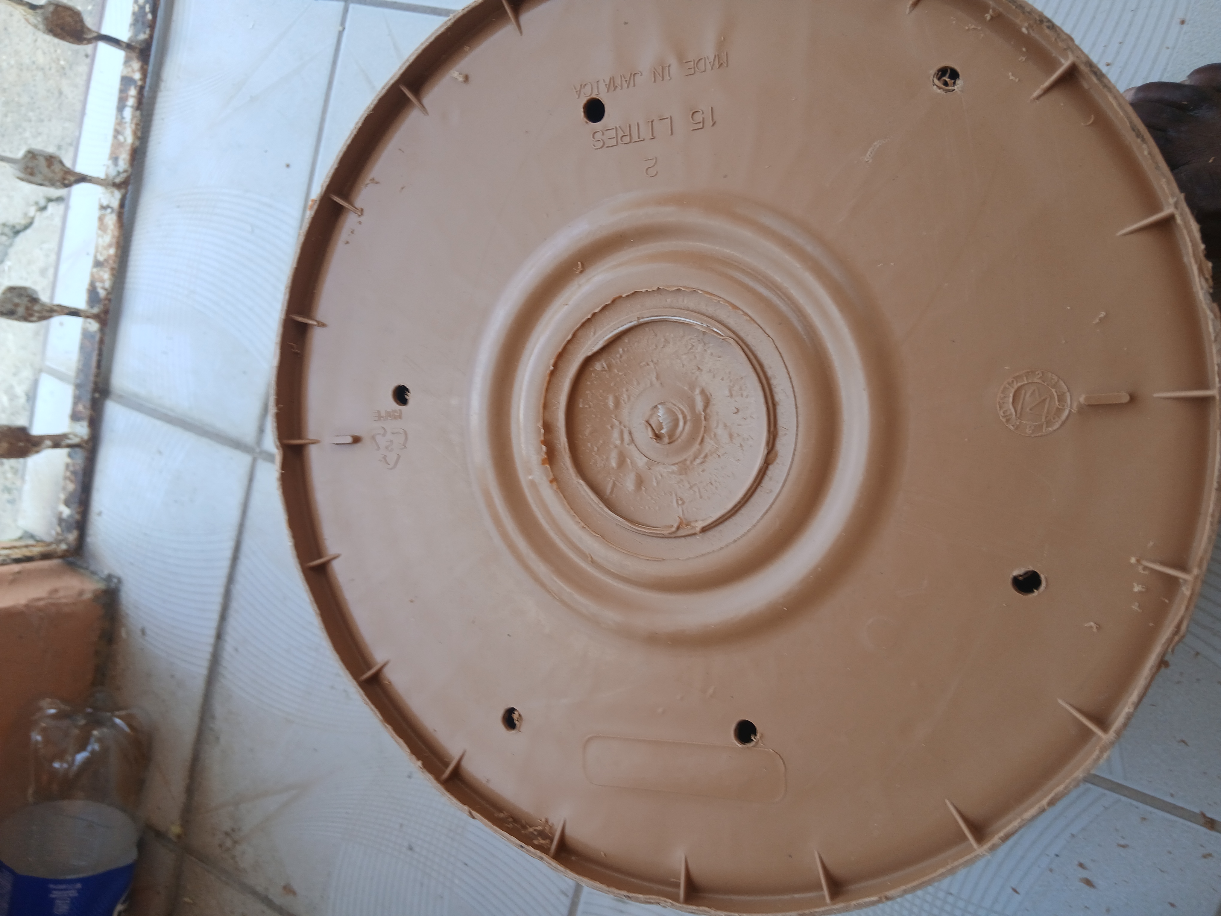 Drainage holes in the bottom of a container