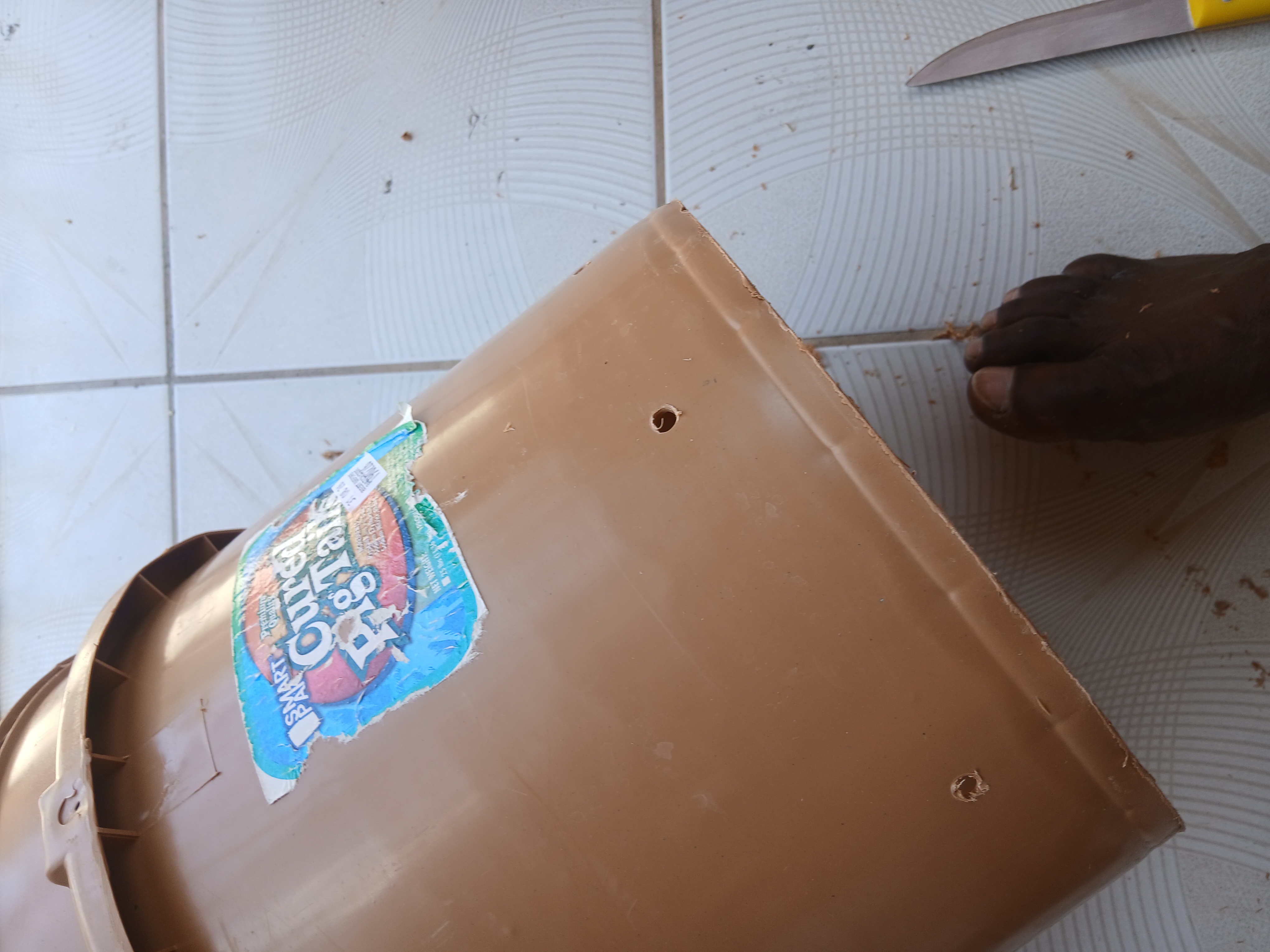 Drainage holes in the side of a container